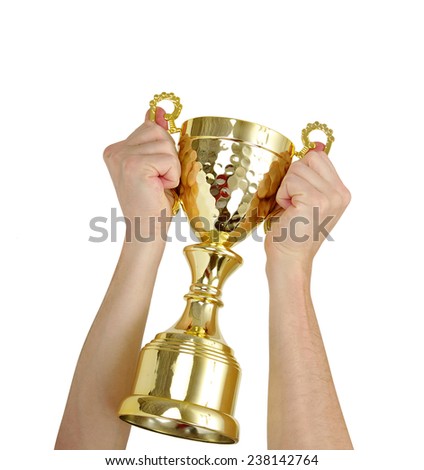 Man holding a champion golden trophy on white background 