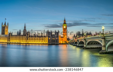 London, the House of Parliament, with the Big Ben and Westminster bridge at dusk Royalty-Free Stock Photo #238146847