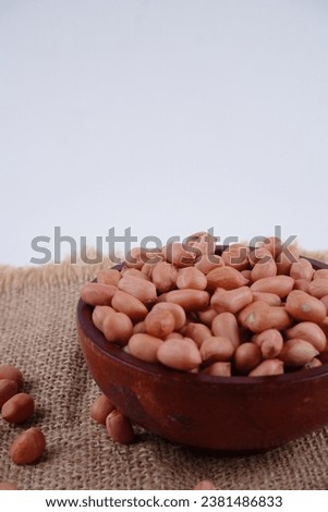 Peanut seeds, or peanuts, are nutrient-dense legumes prized for their high protein content and used in a wide range of culinary applications.
 Royalty-Free Stock Photo #2381486833