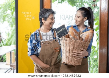 Senior mother and Asian daughter Looking at each other's faces and smiling happily The daughter carried the store's promotional basket.
Open a new business, part-time work, work after retirement Royalty-Free Stock Photo #2381489923