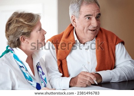 Sign in, hotel and senior couple by reception to check in desk for love, anniversary and relax. Retirement, hospitality resort and elderly man and woman with concierge for travel, holiday or vacation