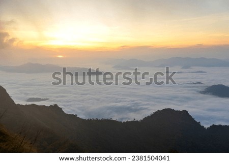 Landscape of Morning Mist with Mountain Layer at north of Thailand. mountain ridge and clouds in rural jungle bush forest