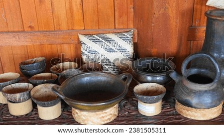 Traditional Cookware, common in West Sumatera and Mostly Indonesia made from  pottery, carved stone or even coconut shell Royalty-Free Stock Photo #2381505311