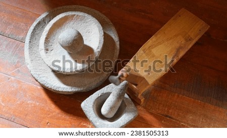 Traditional Cookware, common in West Sumatera and Mostly Indonesia made from  pottery, carved stone or even coconut shell Royalty-Free Stock Photo #2381505313