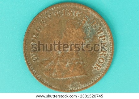 Closeup of a Half Pice coin of British India . Royalty-Free Stock Photo #2381520745