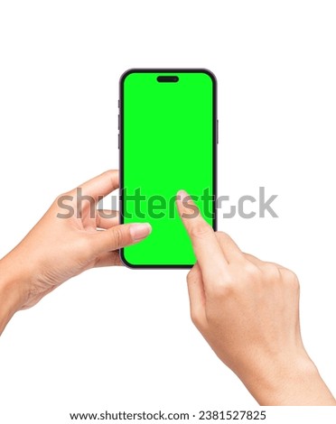 Close up of hand pointing black smartphone with blank green screen mockup in woman hands. Scrolling social media on phone. Presentation Social Media Promotional Tools.