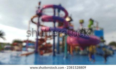 Blur focus of Many travelers have fun in  Water Park, New Destination of Activity in Pattaya  ,Thailand.