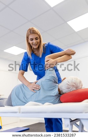 Senior Patient Undergoing Physical Therapy in Clinic to Recover from Surgery and Increase Mobility. Physiotherapist Works on Specific Muscle Groups or Joints to Rehabilitate from Injury.