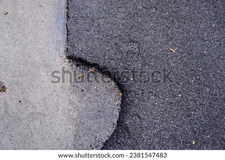 a crack in the pavement.