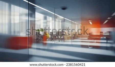Beautiful blurred background of a modern office interior in gray tones with panoramic windows, glass partitions and orange color accents. Royalty-Free Stock Photo #2381560421