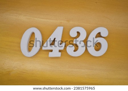 The golden yellow painted wood panel for the background, number 0436, is made from white painted wood.