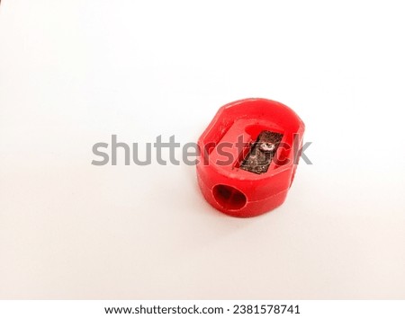 red colored pencil sharpener school equipment isolated on white background