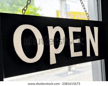 OPEN sign in front of a restaurant