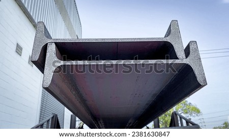 Steel I-beams production. Metal girders stack on project construction , steel h-beam, selective focus, Raw materials used in building construction. Royalty-Free Stock Photo #2381630847