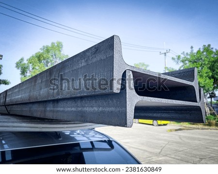 Steel I-beams production. Metal girders stack on project construction , steel h-beam, selective focus, Raw materials used in building construction. Royalty-Free Stock Photo #2381630849