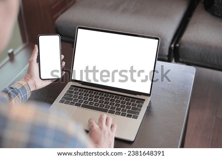 computer screen,cell phone blank mockup.hand woman work using laptop texting mobile.white background for advertising,contact business search information on desk in cafe.marketing,design