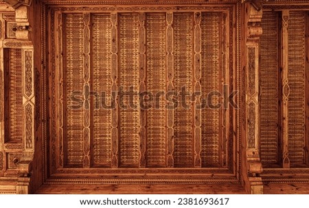 Fragment of an ancient carved wooden pattern. Ornate background. Abstract background for design.