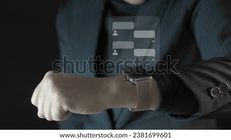 Businessman using a social media marketing concept on smartwatch with notification icons of message.