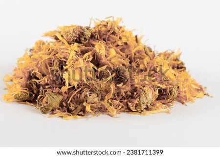 pile of calendula flowers, Calendula officinalis, dried, isolated on white background and copy space.