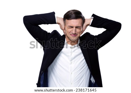 Businessman holding hands on the ears over white background