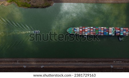 Panama Canal, Canal locks, Maritime Transit, container ship, Gatun Lake, climate change, Panama mining, tug Royalty-Free Stock Photo #2381729163