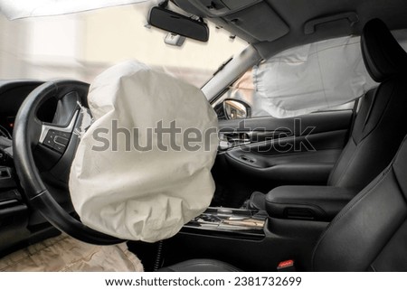 Airbag immediately after a traffic accident Royalty-Free Stock Photo #2381732699