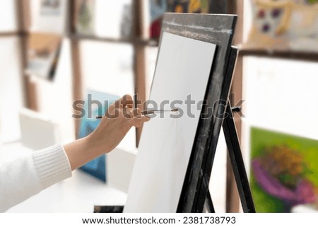 person draws a sketch on a white blank paper