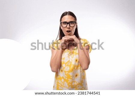 portrait of a slender young woman with glasses for vision correction on a white background