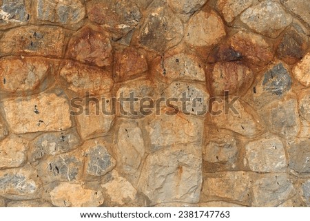 hard stones stack or modern rock wall dam and brown gray granite floor or old yellow stone jigsaw dirty rust stain on top view for strong background or texture wallpaper and architectural construction