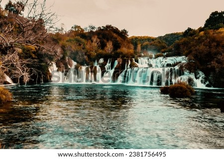 The beautiful view of the waterfalls surrounded by lush vegetation. Krka National Park, Croatia.