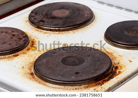 Dirty white electric stove with fat on surface Royalty-Free Stock Photo #2381758651