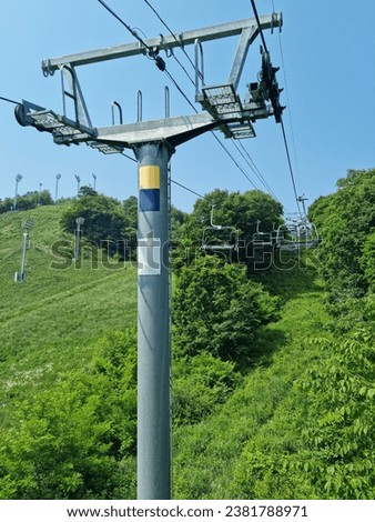 A ski lift in the woods.