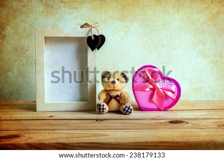 Still life with gift box on wooden table over grunge background, Valentine concept