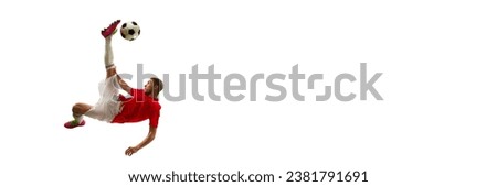 Banner. Professional soccer player looks confident in sportwear and boots kicking ball for goal in jump against white background. Football school. Concept of game, sport, recreation, active lifestyle.