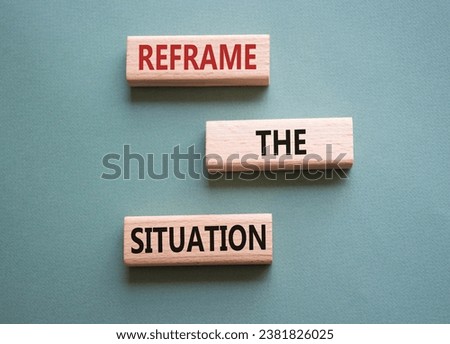 Reframe the situation symbol. Concept words Reframe the situation on wooden blocks. Beautiful grey green background. Business concept. Copy space.