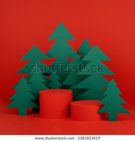 Christmas art one cylinder podiums and red stage for presentation gifts, cosmetic products, goods, green paper spruces in cartoon style, copy space, square. New year template for advertising, design.