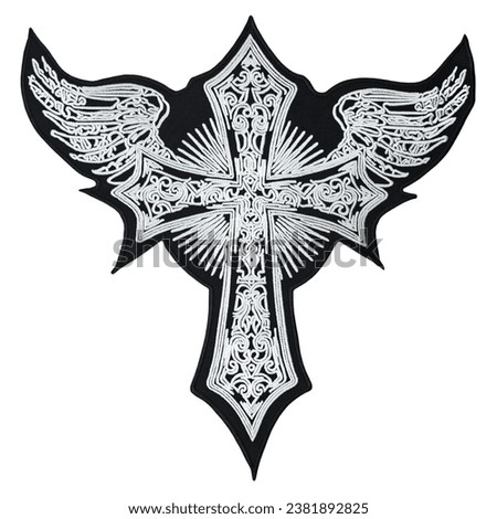 Embroidered patch with the image of celtic cross with wings. Accessory for rockers, bikers, metalheads and punks. Occult symbolism. Royalty-Free Stock Photo #2381892825