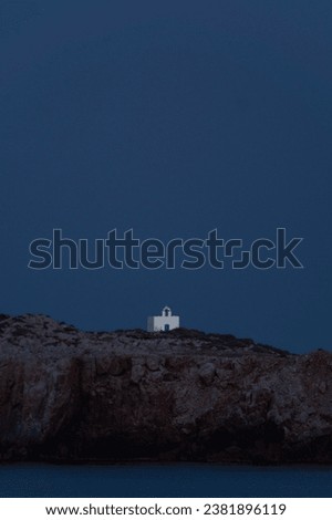 Picture of a church on an island by night