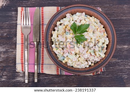Russian traditional salad olivier with pea in the plate