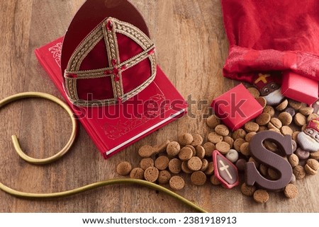 Dutch holiday Sinterklaas background with mitre or mijter staff and book of Sinterklaas.