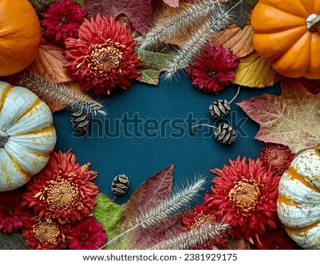 Deep orange chrysanthemums combine with mini pumpkins, grasses, autumn leaves, and small cones in this photo background or frame designed for fall announcements, invites, presentations, or PowerPoints