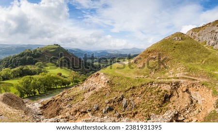 The ruins of Castell Dinas Bran pictured on top of a hill at Llangollen in Wales seen from the edge of Clwydian Range.