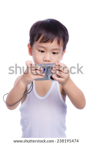 Portrait of asian boy (thai) in a white singlet interesting digital compact photo camera with good intentions