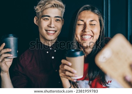 positive japanese friends spending free time together and taking pictures