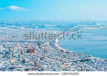 Beautiful landscape and cityscape from Hakodate Mountain with Snow in winter season. landmark and popular for attractions in Hokkaido, Japan.Travel and Vacation concept Royalty-Free Stock Photo #2381960201