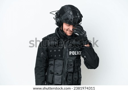 SWAT man over isolated white background laughing