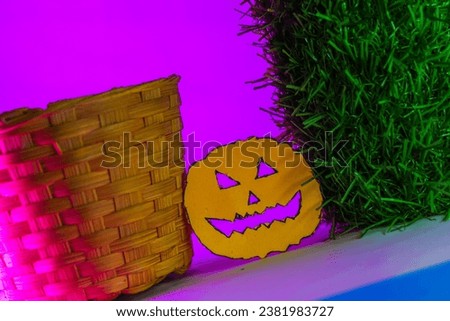 Halloween shaped paper cuttings place on a colorful background
