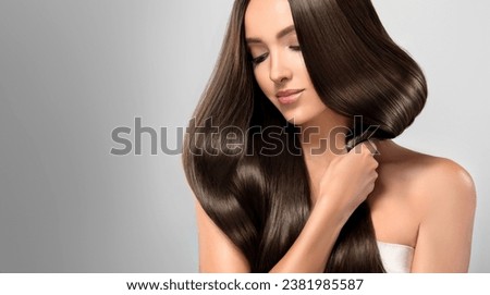 Beautiful model girl with shiny brown and straight long  hair . Keratin  straightening . Treatment, care and spa procedures. Smooth hairstyle
 Royalty-Free Stock Photo #2381985587