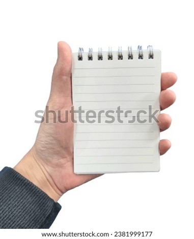 a picture of one's hand holding a notebook