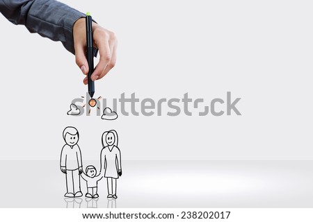 Close up of hand drawing sketches of happy family